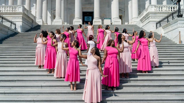 Group portrait in pink dresses on the United States Capitol steps