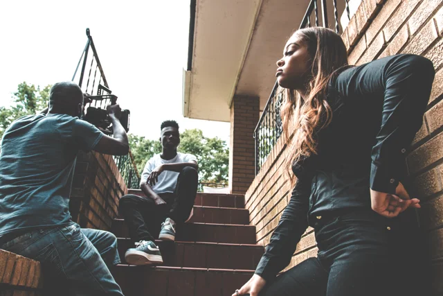 Outdoor group portrait on brick steps in warm natural light